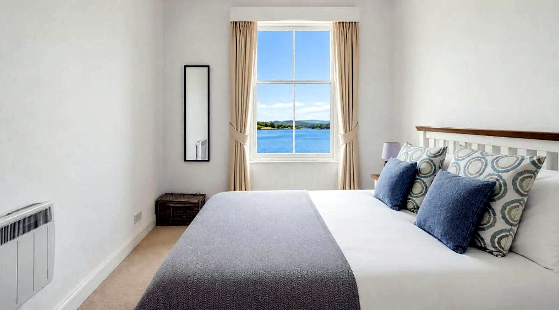 Sea-facing bedroom at Govandale Seaviews with a sash window over the water