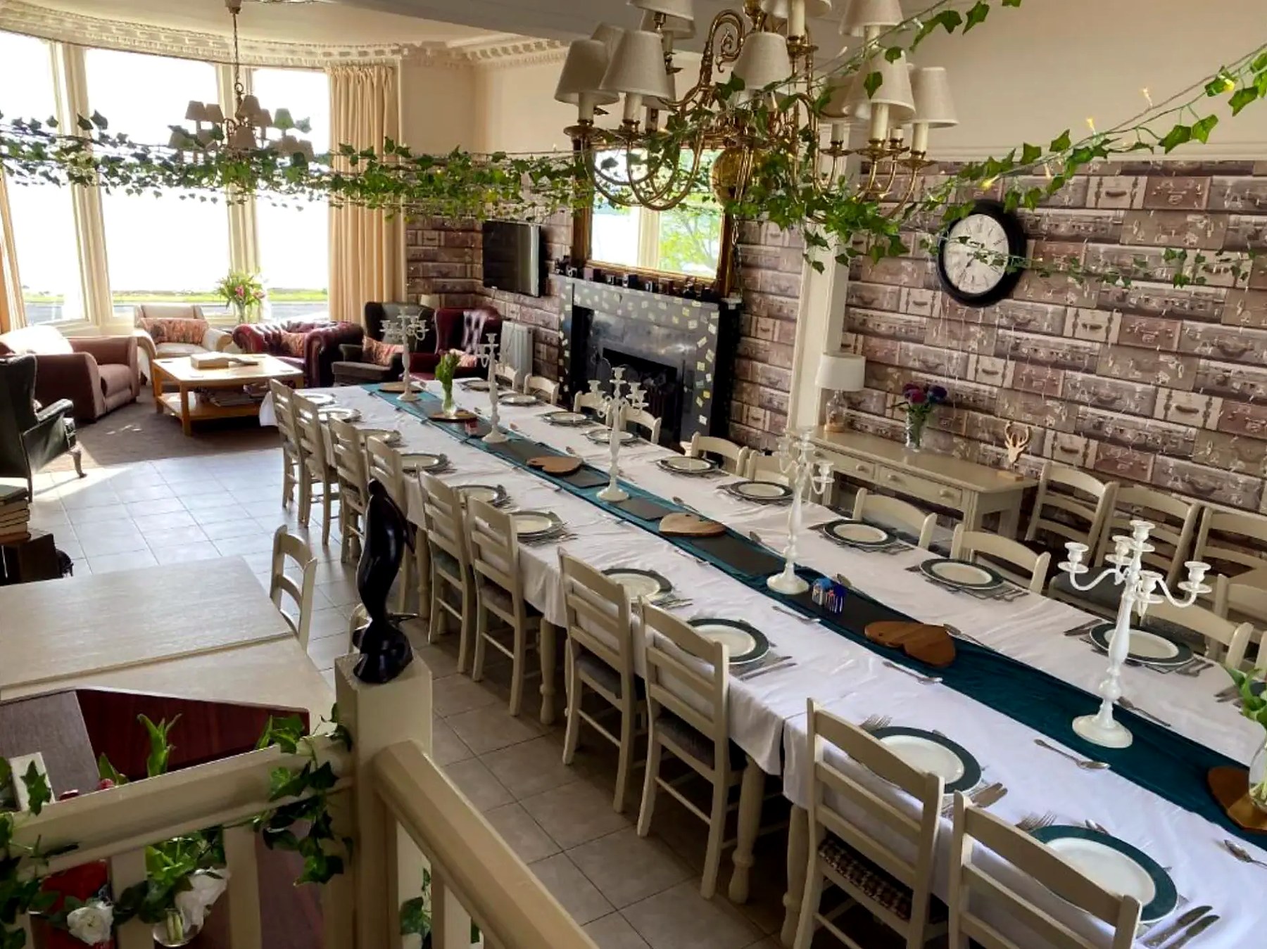 Long table set for a party in the dining hall at St Blanes House