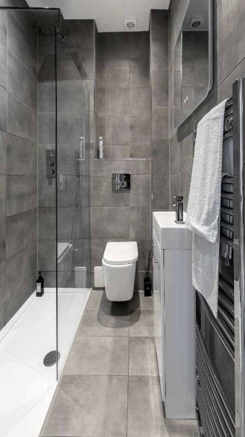 The tiled shower room at The Hidden Asset with a walk-in rainfall shower
