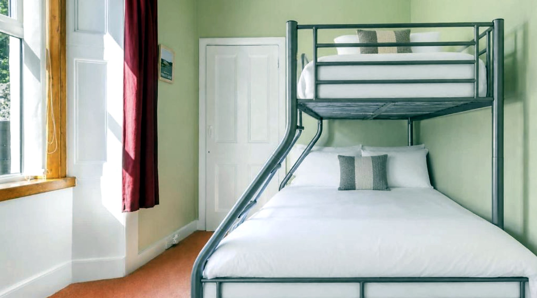 Family room at Ardyne House with a bunk bed over a double bed and a sunny window