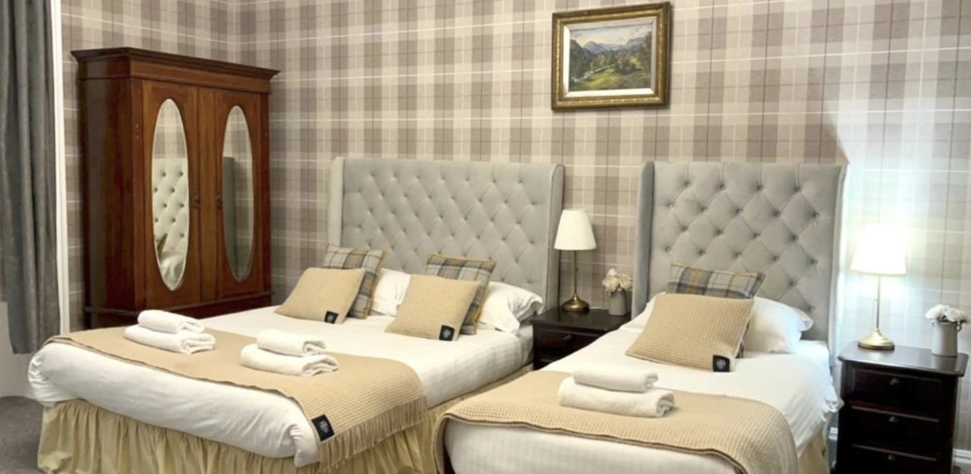 A bright twin room at Cannon House with tartan soft furnishings