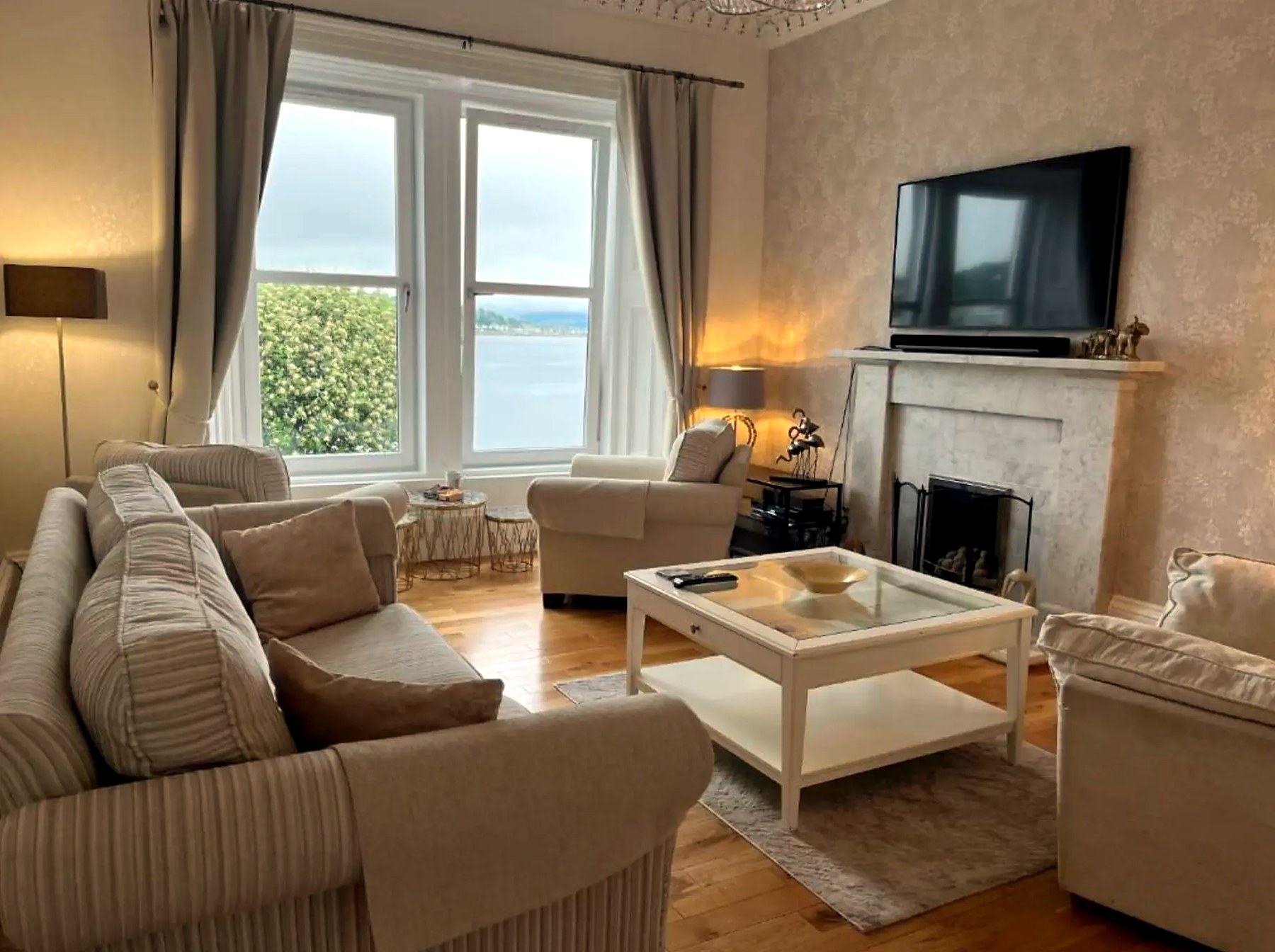 Sea-view sitting room at Harbour View looking over Rothesay Bay