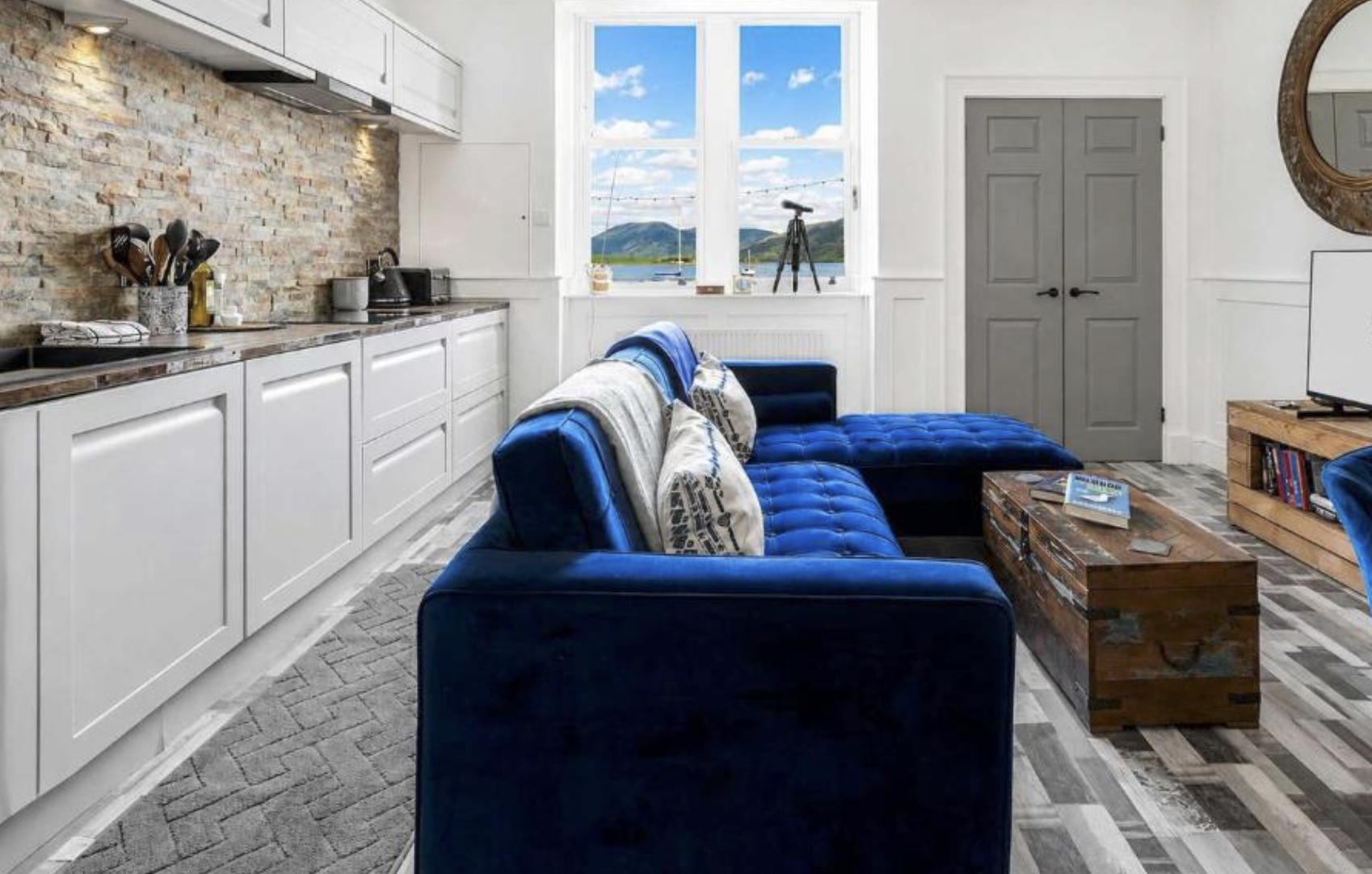 Open-plan living room at Melbourne Place looking out over Rothesay Bay