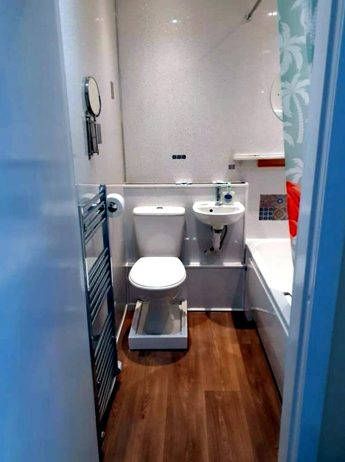 Private bathroom at Commodore Guest House with bath, basin and heated towel rail