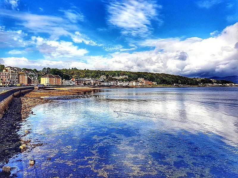 Low tide at Rothesay Bay on the Isle of Bute, with clear shallows and the seafront terraces beyond