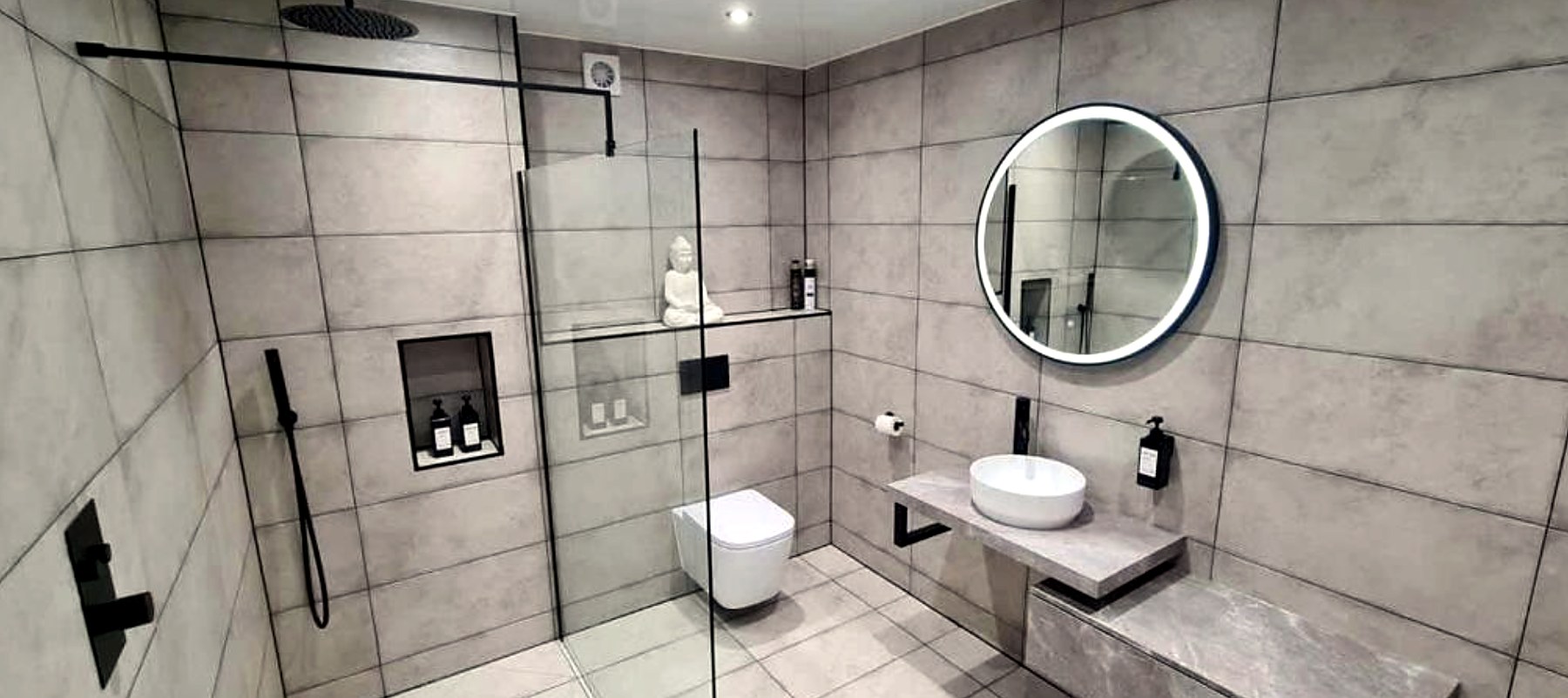 Large tiled walk-in shower room with rainfall shower at The Old Courthouse