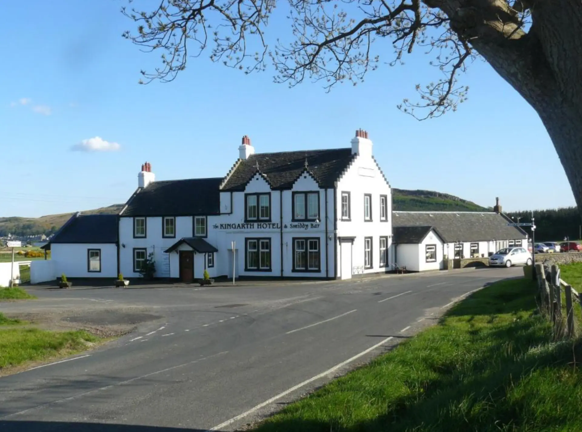 The white-painted Kingarth Hotel and Smiddy Bar at the southern Bute crossroads