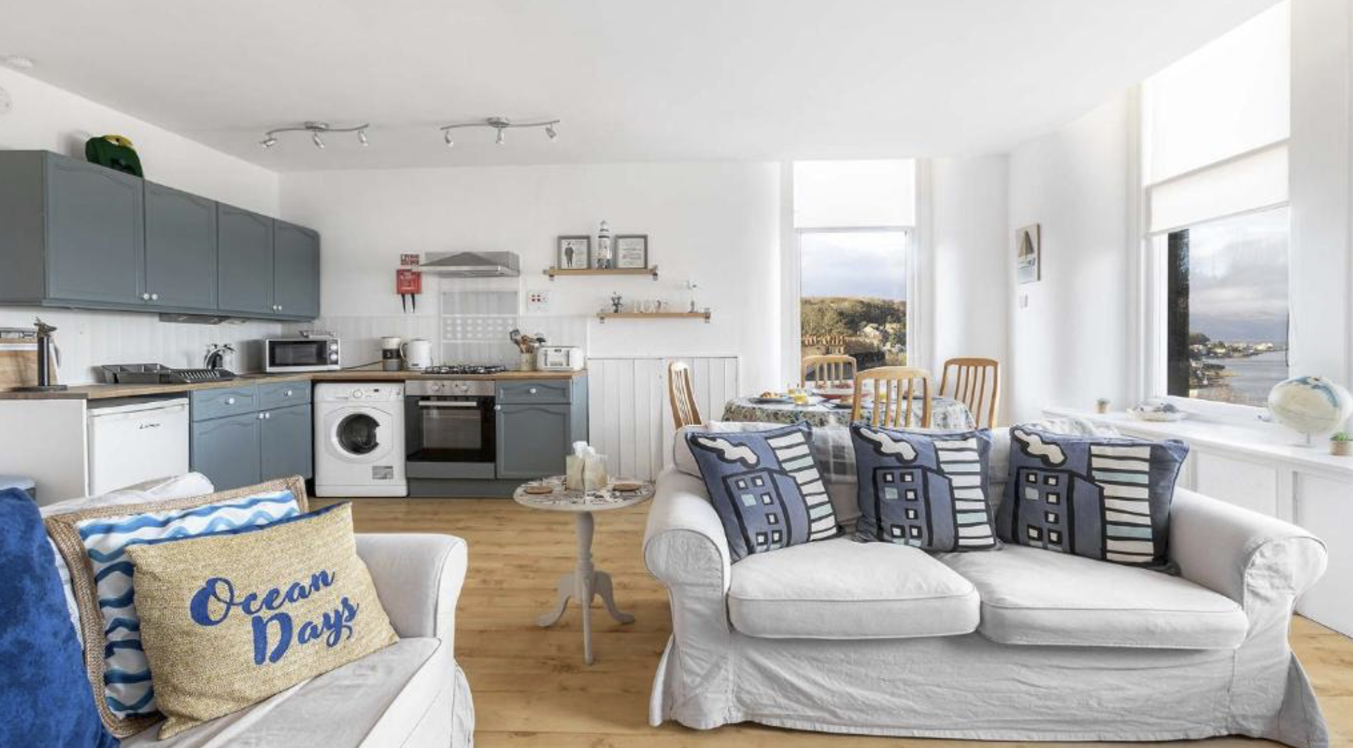 The open-plan living room and blue kitchen at The Hidden Asset, Rothesay