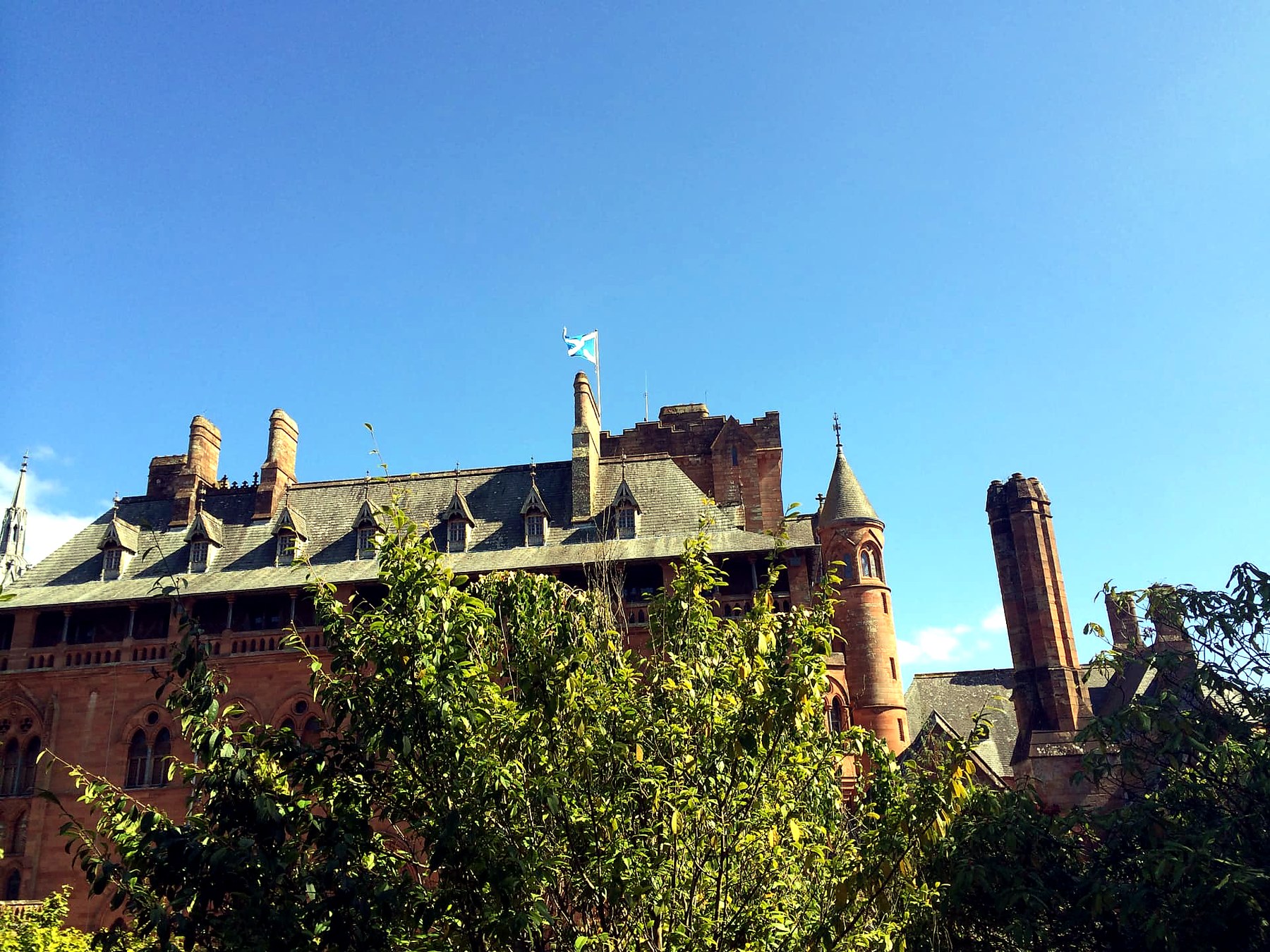 The red sandstone turret, chimneys and dormer windows of Mount Stuart House on the Isle of Bute