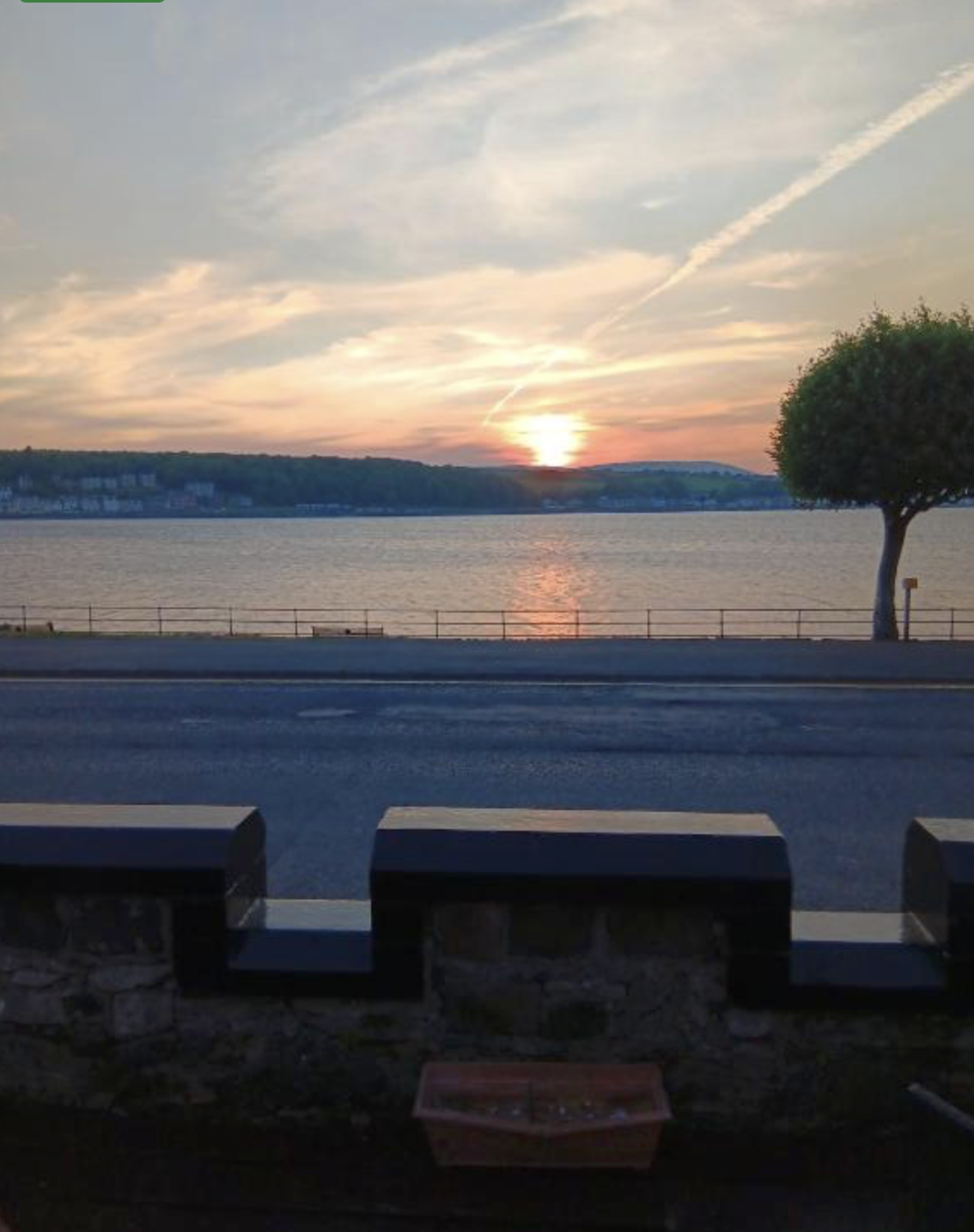 Sunset over the Firth of Clyde seen from Battery Lodge on Rothesay's seafront