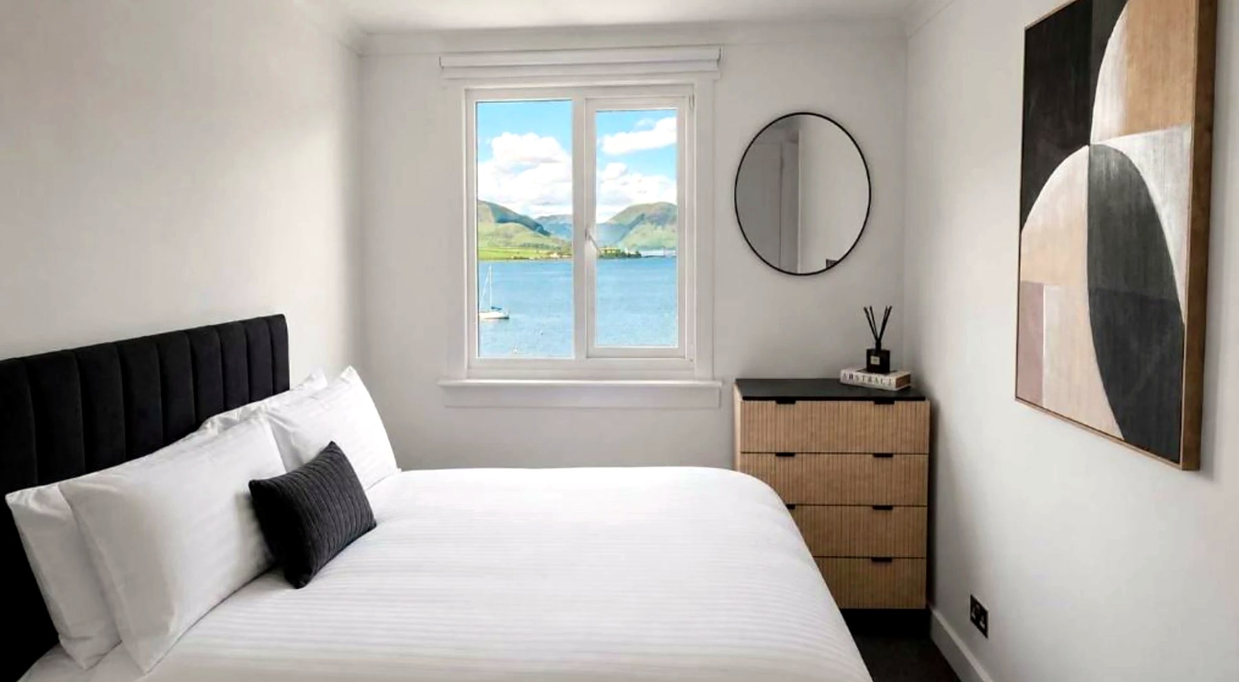 Second double bedroom at Bayview at the Port with a sea view and yacht on the bay