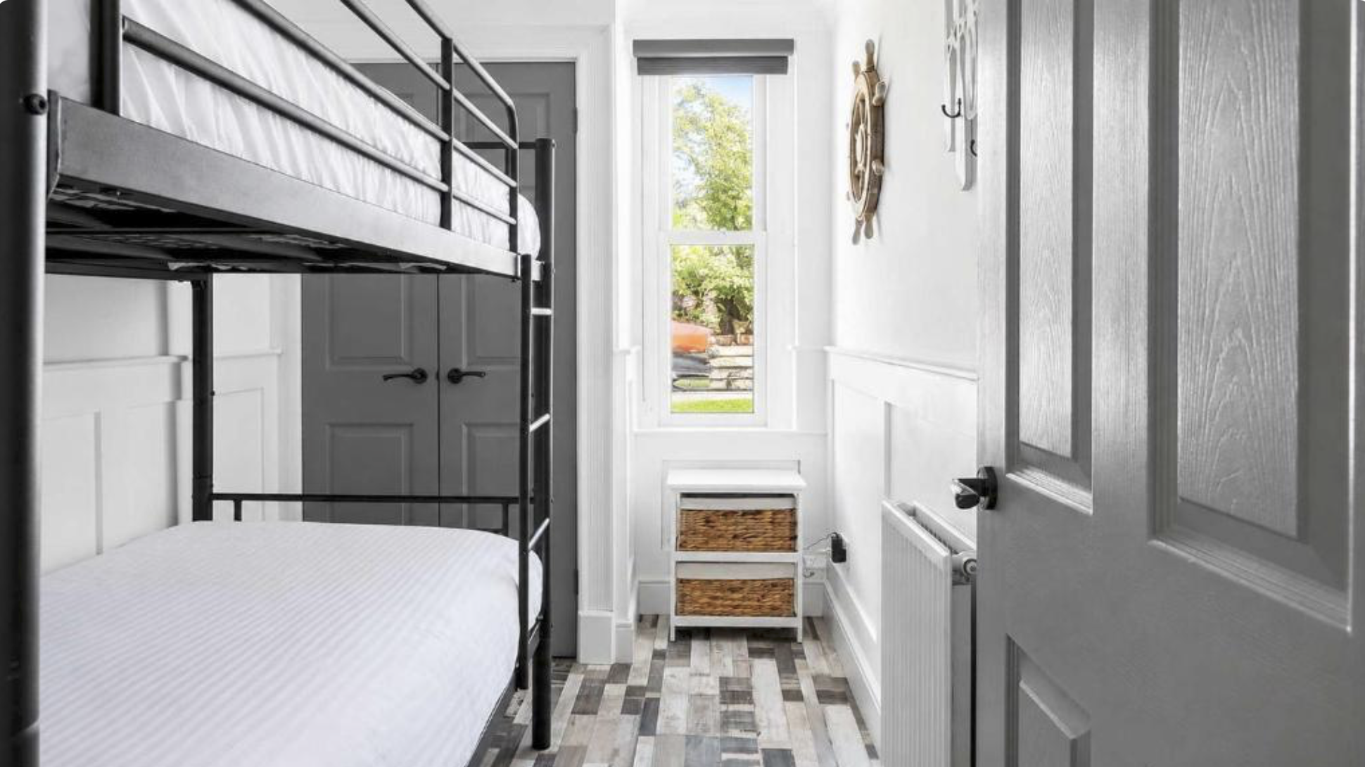 Bunk beds with white linen in a bright room at Melbourne Place