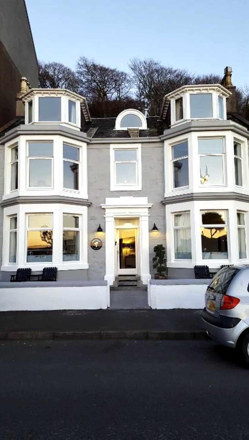 The white bay-windowed frontage of Boat House Super Suites, Rothesay