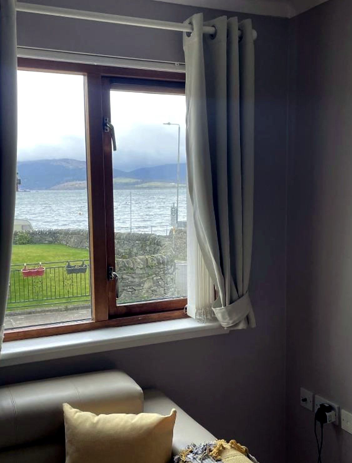 Window at Fraoch looking across Kames Bay to the Cowal hills