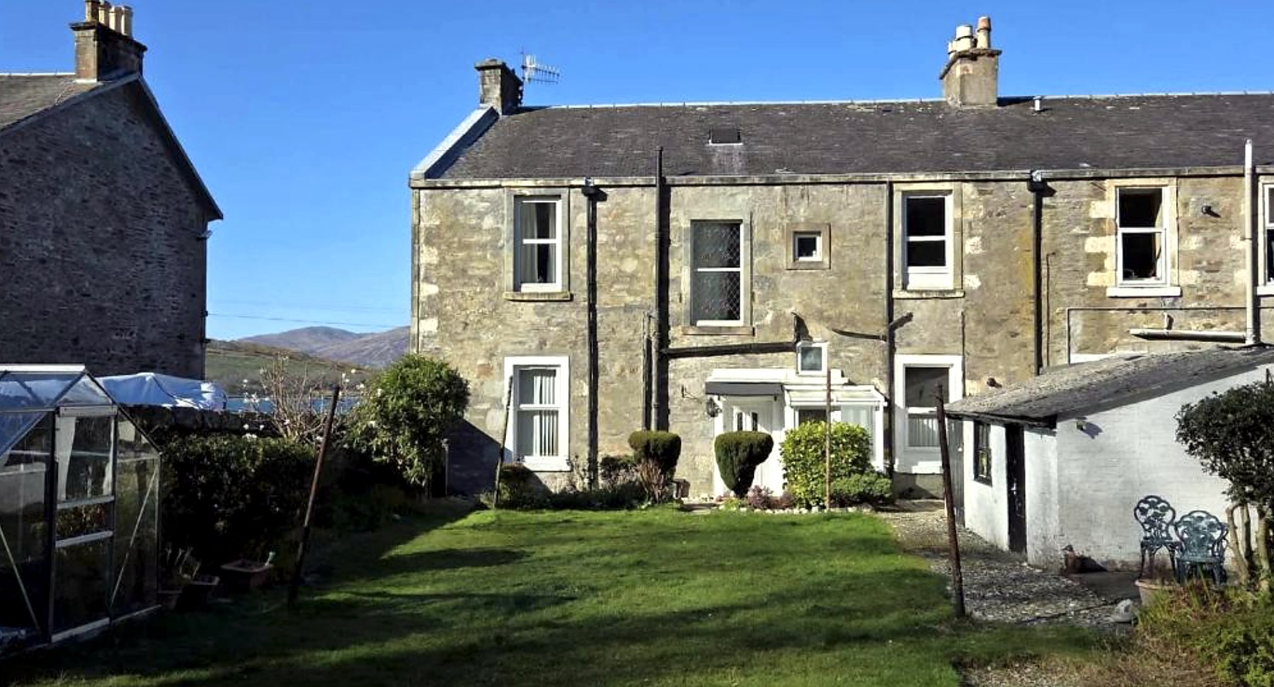 Stone frontage and lawned garden at Ardyne House, Rothesay